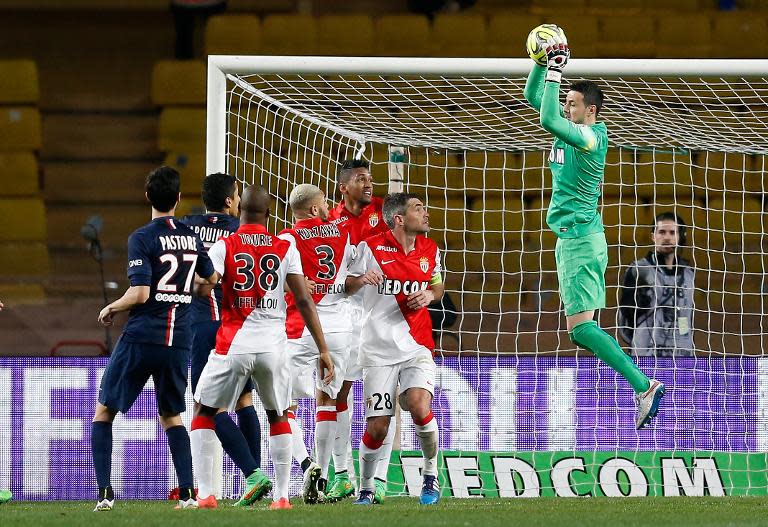 Monaco's Croatian goalkeeper Danijel Subasic (R) catches the ball during the French L1 football match against Paris Saint-Germain on March 1, 2015 at Louis II stadium in Monaco