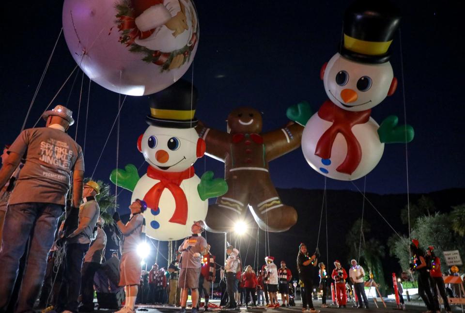 Balloons are lined up before the Festival of Lights Parade, Saturday, Dec. 4, 2021, in Palm Springs, Calif. 