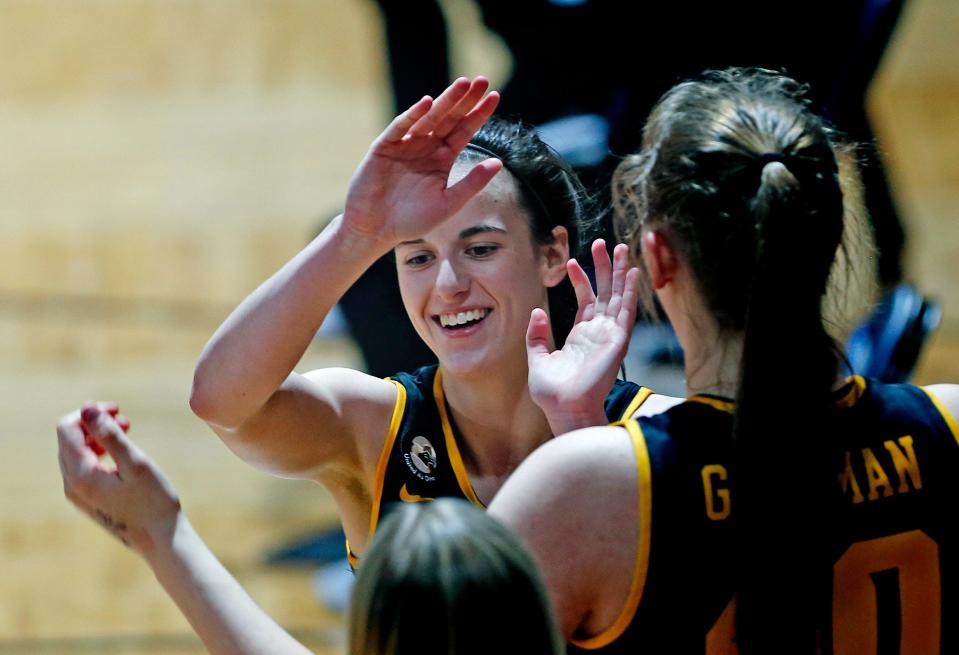 Iowa guard Caitlin Clark is congratulated during a game against Kentucky.