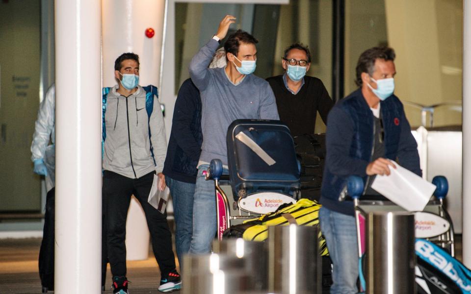 Spain's Rafael Nadal, center, arrives at Adelaide Airport ahead of the Australian Open tennis championship, Adelaide, Australia, Thursday - AP