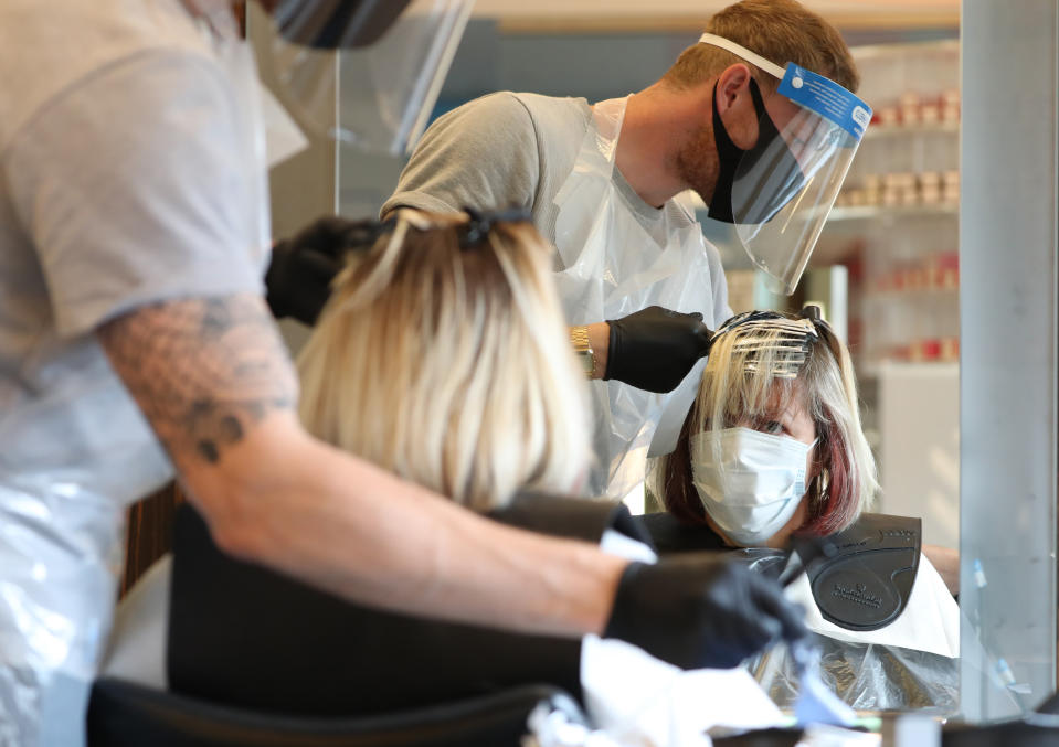 People can now get a haircut as long as the establishment is following the government guidelines. (Getty)