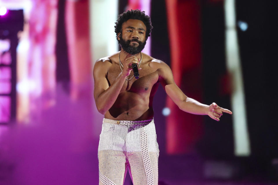 FILE - In this Friday, Sept. 21, 2018 file photo, Childish Gambino performs at the 2018 iHeartRadio Music Festival Day 1 held at T-Mobile Arena in Las Vegas. Hip-hop has been an integral part of social and racial justice movements.It’s also been scrutinized by law enforcement and political groups because of their belief that hip-hop and its artists’ encourage violent criminality. Free speech advocates see the ongoing persecution of rappers as a proxy war primarily waged against Black and Latino people who are the early pioneers of the culture. His hit “This is America,” is a commentary on violence and systemic racism in the U.S. The song made history in 2019 as the first hip-hop track to win the song of the year Grammy – and it was parodied by global artists to speak to corruption and injustice in Nigeria, Malaysia and Australia. (Photo by John Salangsang/Invision/AP, File)