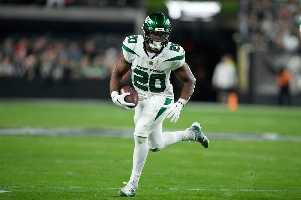 New York Jets running back Breece Hall runs with the ball during the first half of an NFL football game against the Las Vegas Raiders Sunday, Nov. 12, 2023, in Las Vegas. (AP Photo/John Locher)