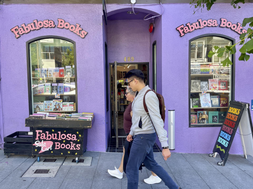 Pedestrians walk past the Fabulosa Books store in San Francisco's Castro District on Thursday, June 27, 2024. The bookstore is sending LGBTQ+ books to parts of the country where they are censored to counter the rapidly growing effort by anti-LGBTQ+ activists and lawmakers to ban queer-friendly books from public schools and libraries. (AP Photo/Haven Daley)