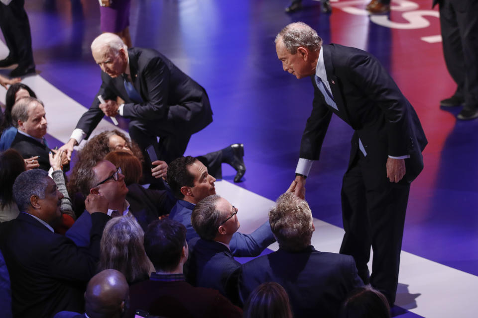 Democratic presidential candidates, former New York City Mayor Mike Bloomberg, right, and former Vice President Joe Biden, left, greet supporters at the end of the Democratic presidential primary debate at the Gaillard Center, Tuesday, Feb. 25, 2020, in Charleston, S.C., co-hosted by CBS News and the Congressional Black Caucus Institute. (AP Photo/Patrick Semansky)