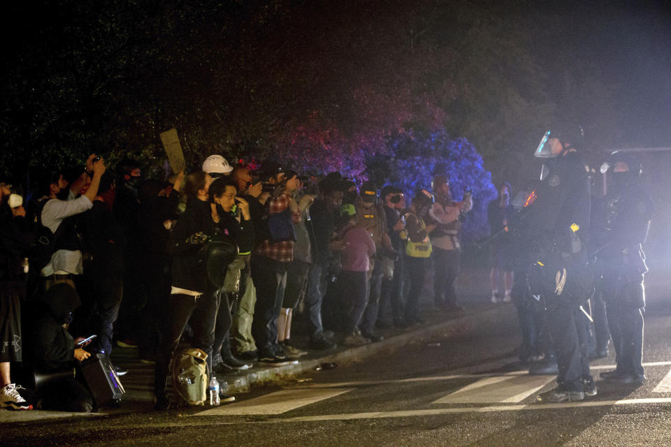 Demonstrators gathered at Floyd Light City Park on Thursday, Aug. 6, 2020 in Portland, Ore. State legislatures across the U.S. are pushing an array of policing reforms after the demonstrations related to the death of George Floyd last spring, from banning chokeholds to making it easier to hold officers legally accountable for their actions. (Mark Graves/The Oregonian via AP)