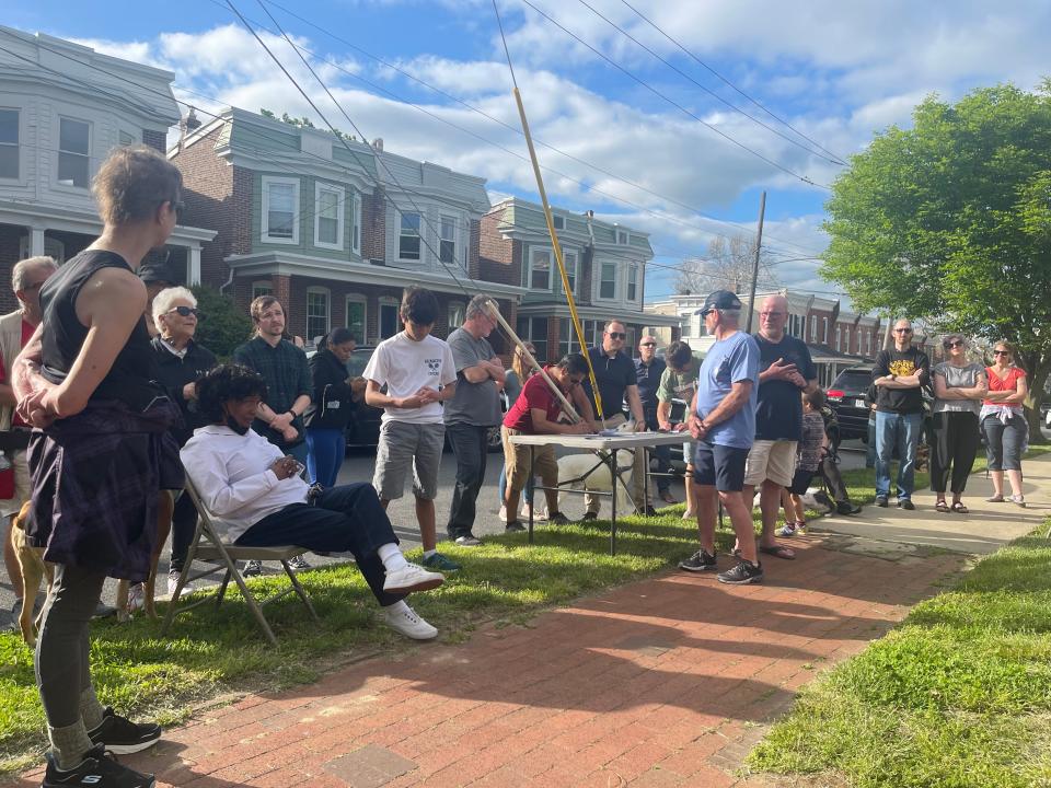 About 50 people gather outside Rodney Street Park on Thursday, May 12, 2022, concerned about Wilmington officials' plans to demolish the unused reservoir at the park and turn the property into residential housing.