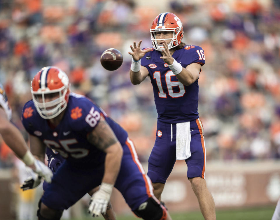 Clemson quarterback Trevor Lawrence (16) takes a snap during the first half of an NCAA college football game against Pittsburgh Saturday, Nov. 28, 2020, in Clemson, S.C. (Ken Ruinard/The Independent-Mail via AP, Pool)