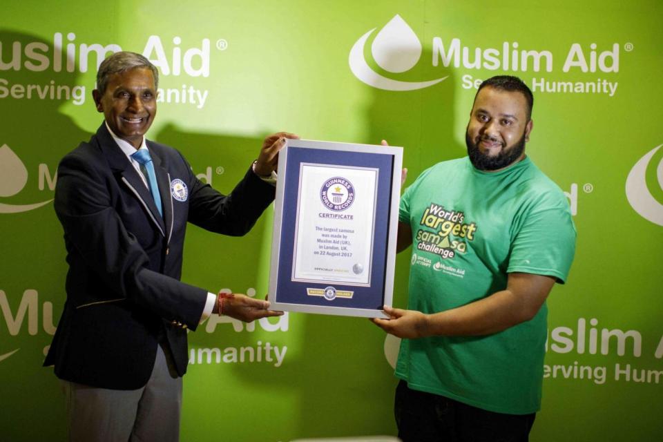 Achievement: Guinness adjudicator awards the world record to Muslim Aid's Foredul Islam (Tolga Akmen)