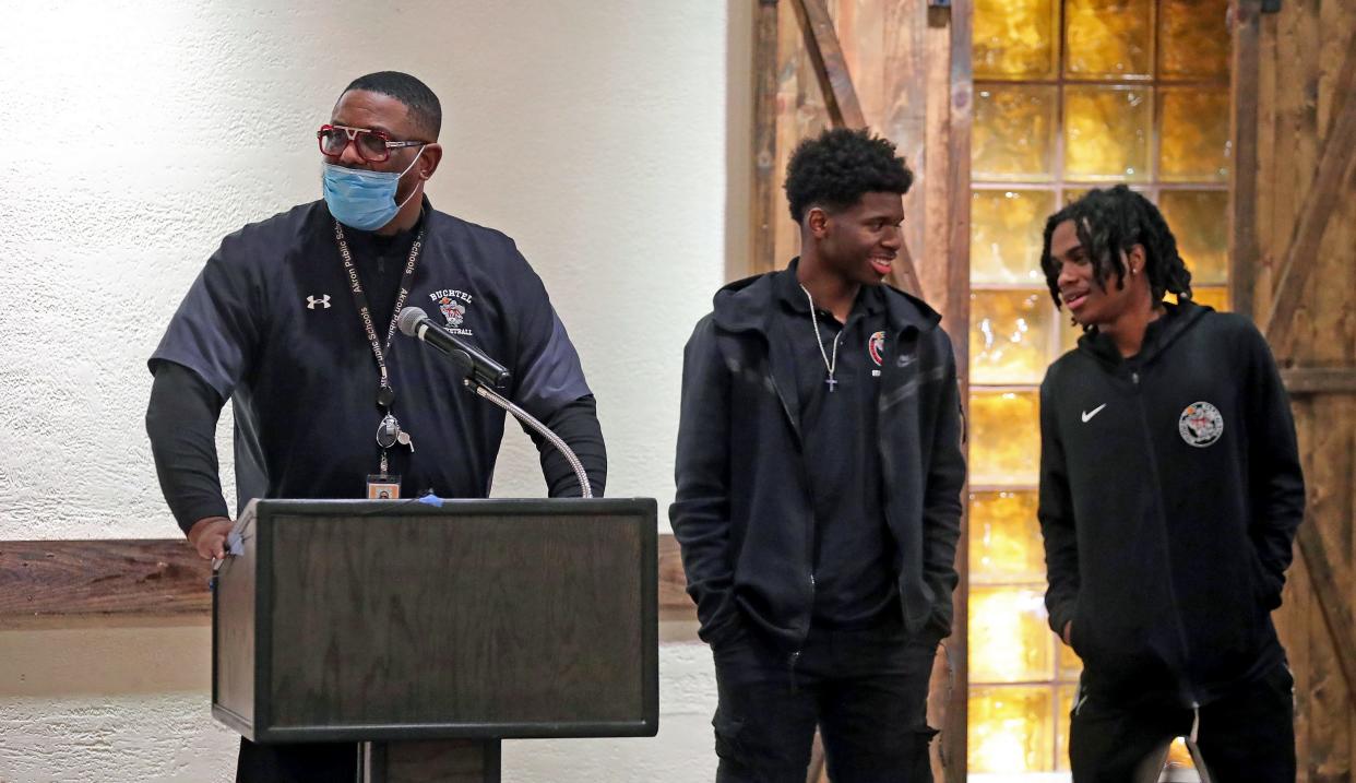 Buchtel boys basketball coach Rayshon Dent, left, introduces Qi’Marreon Marks and Diaire Pride during the Akron City Series high school basketball media day at Guy’s Party Center on Tuesday in Akron.