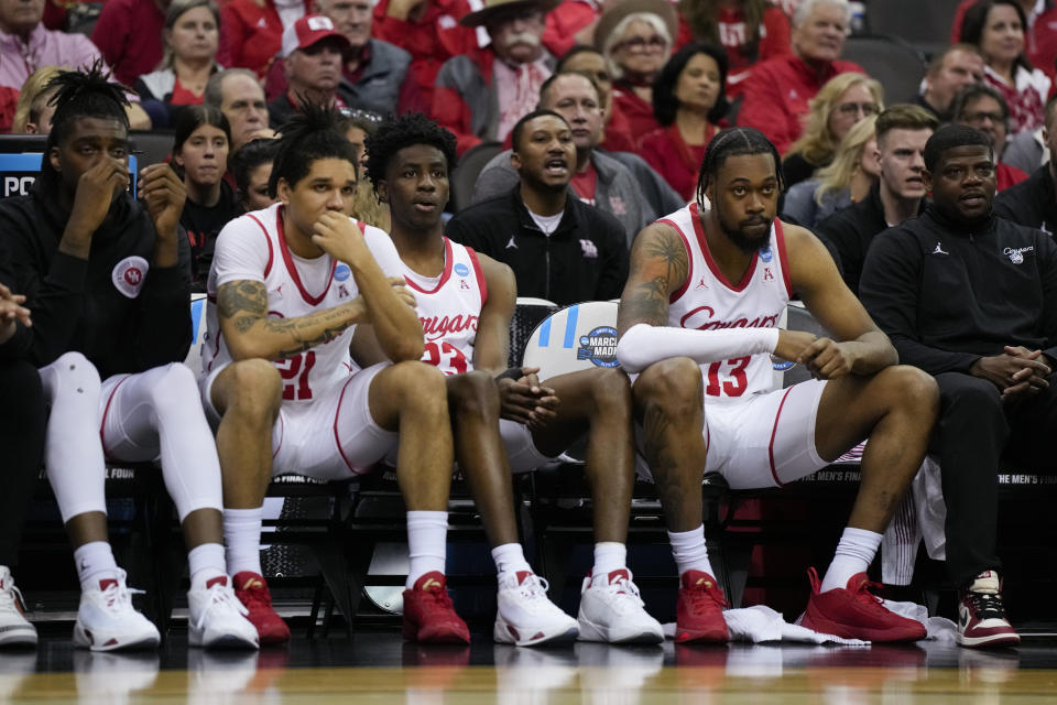Members of the Houston team sit on the bench during their loss against Miami in a Sweet 16 college basketball game in the Midwest Regional of the NCAA Tournament Friday, March 24, 2023, in Kansas City, Mo. (AP Photo/Jeff Roberson)