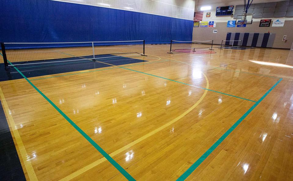 The gym court includes lines and nets for pickleball at Wellington's Village Park Athletics Complex.