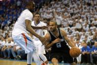 May 6, 2016; Oklahoma City, OK, USA; San Antonio Spurs guard Tony Parker (9) drives to the basket against Oklahoma City Thunder forward Serge Ibaka (9) during the fourth quarter in game three of the second round of the NBA Playoffs at Chesapeake Energy Arena. Mandatory Credit: Mark D. Smith-USA TODAY Sports