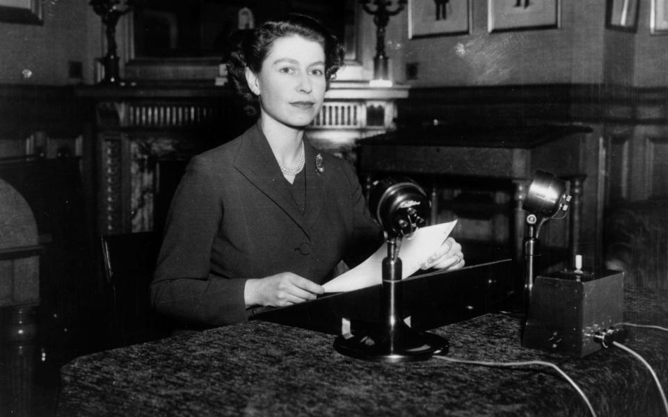 Queen Elizabeth II making her first ever Christmas broadcast to the nation from Sandringham House, Norfolk in 1952 - Fox Photos/Hulton Archive/Getty Images