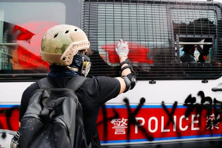 Demonstrators march to protest against the Yuen Long attacks in Yuen Long