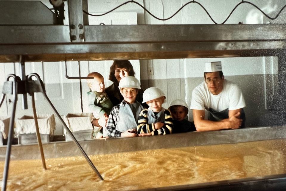 Owners and parents Jan and Dave Metzig pose in this undated photo in Union Star Cheese Factory with their four sons, from left, Jon, Charlie, Louie and Matt.