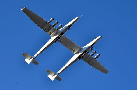 The world's largest airplane, built by the late Paul Allen's company Stratolaunch Systems, makes its first test flight in Mojave, California, U.S. April 13, 2019. REUTERS/Gene Blevins