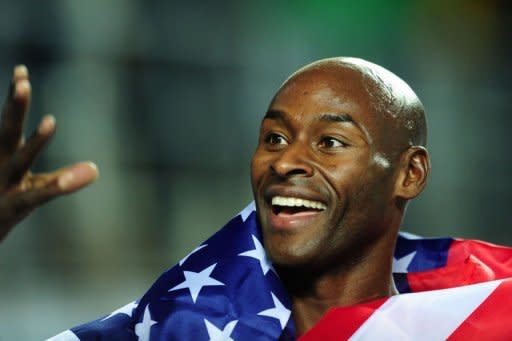 US athlete Bernard Lagat celebrates with a national flag winning gold in the men's 3000m final at the 2012 IAAF World Indoor Athletics Championships at the Atakoy Athletics Arena in Istanbul