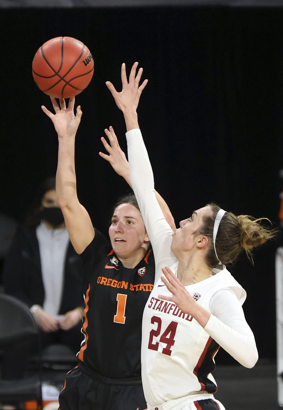 Oregon State guard Aleah Goodman (1) shoots as Stanford guard Lacie Hull (24) defends during the second half of an NCAA college basketball game in the semifinal round of the Pac-12 women's tournament Friday, March 5, 2021, in Las Vegas. (AP Photo/Isaac Brekken)