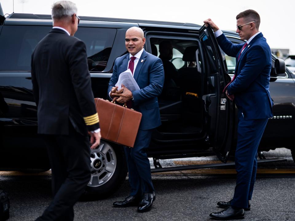 Walt Nauta follows former President Donald Trump as they board his airplane, known as "Trump Force One," as Trump heads to speak at campaign events.