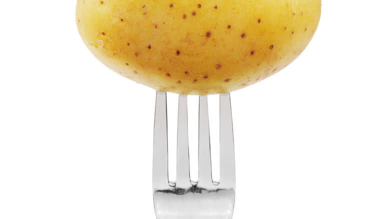 fork piercing potato