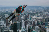 <p>A base jumper leaps from the 300-metre high open deck at Malaysia’s Kuala Lumpur Tower during the International Tower Jump on Oct. 1, 2016 in Kuala Lumpur, Malaysia. More than 121 professional base jumpers from 20 countries including France, United States, Australia, Brazil, Germany, Canada and South Korea will take part in the 3-day event. (Photo: Mohd Samsul Mohd Said/Getty Images)</p>