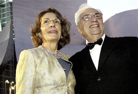 Frank Gehry, who designed the Walt Disney Concert Hall, arrives for the opening night of the $274 million music facility with Diane Disney Miller, daughter of Walt Disney, in Los Angeles in this file photo from October 23, 2003. REUTERS/Robert Galbraith/Files