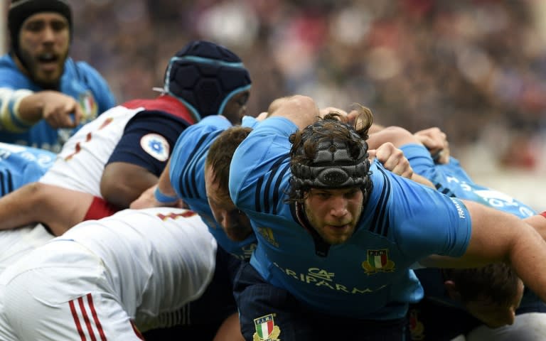 Italy's lock Marco Fuser (R) is tackled during their Six Nations rugby union match against France, at the Stade de France in Saint-Denis, north of Paris, on February 6, 2016