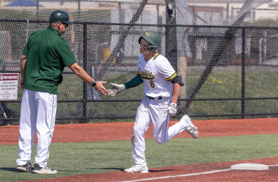 Red Bank Catholic's Alex Stanyek, shown shaking head coach Buddy Hausmann's hand after a home run against Donovan Catholic on April 15, said he wants to be the starting pitcher Sunday night when the Caseys meet Ranney in the Shore Conference Tournament championship at ShoreTown Ballpark, Lakewood.