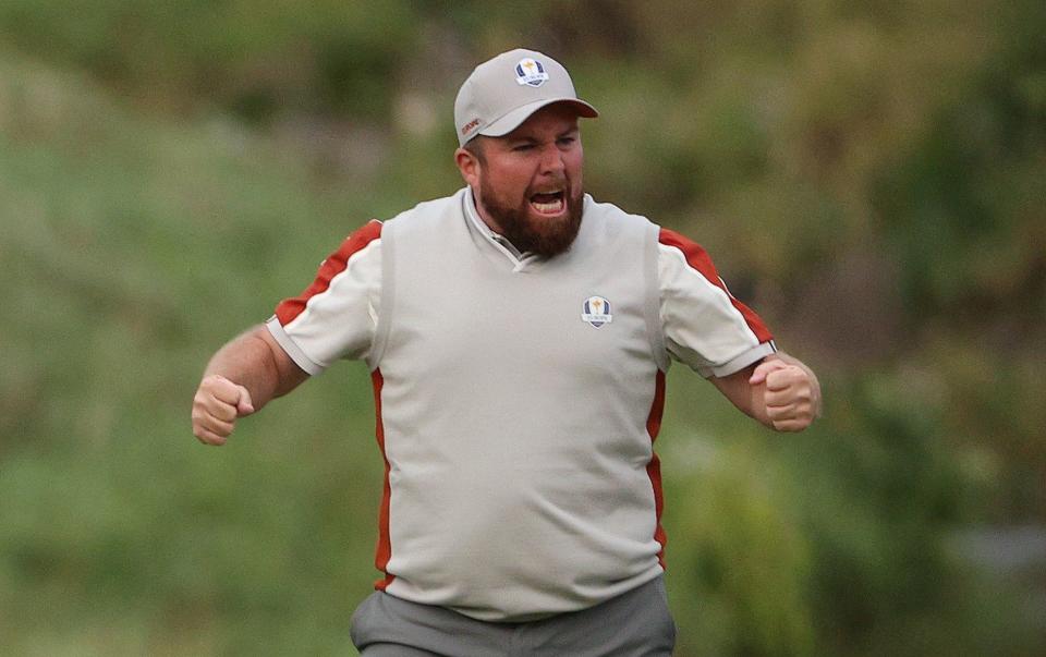 Shane Lowry of Ireland and team Europe reacts on the 18th green