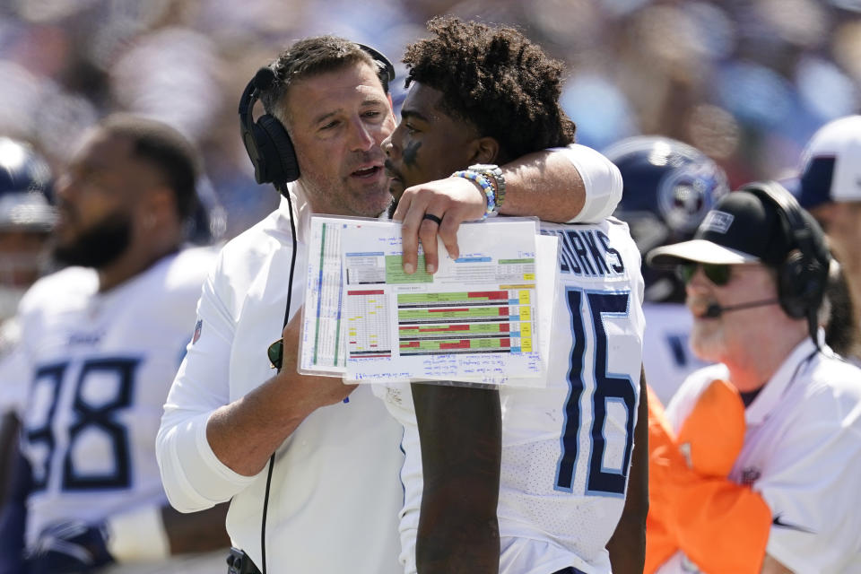 Tennessee Titans head coach Mike Vrabel talks to wide receiver Treylon Burks (16) during the first half of an NFL football game against the Los Angeles Chargers Sunday, Sept. 17, 2023, in Nashville, Tenn. (AP Photo/George Walker IV)