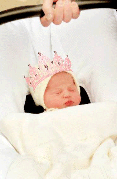 Princess Charlotte wears a tiara on her way home from hospital.