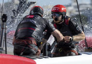 Grinders in action on Denmark SailGP Team presented by ROCKWOOL helmed by Nicolai Sehested on Race Day 1 of the Spain Sail Grand Prix in Cadiz, Andalusia, Spain, Saturday, Sept. 24, 2022. (Ian Walton/SailGP via AP)