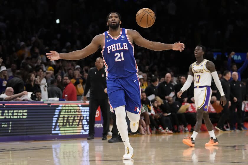 Philadelphia 76ers center Joel Embiid (21) celebrates after a 113-112 win over the Los Angeles Lakers in an NBA basketball game in Los Angeles, Sunday, Jan. 15, 2023. (AP Photo/Ashley Landis)