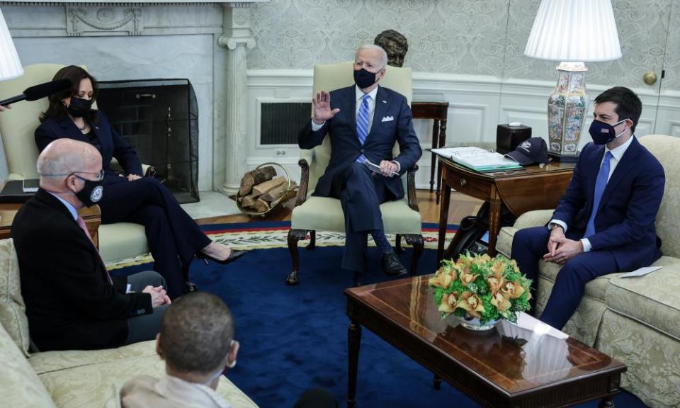 Biden with Buttigieg and other members of the bipartisan group at the White House on Thursday.