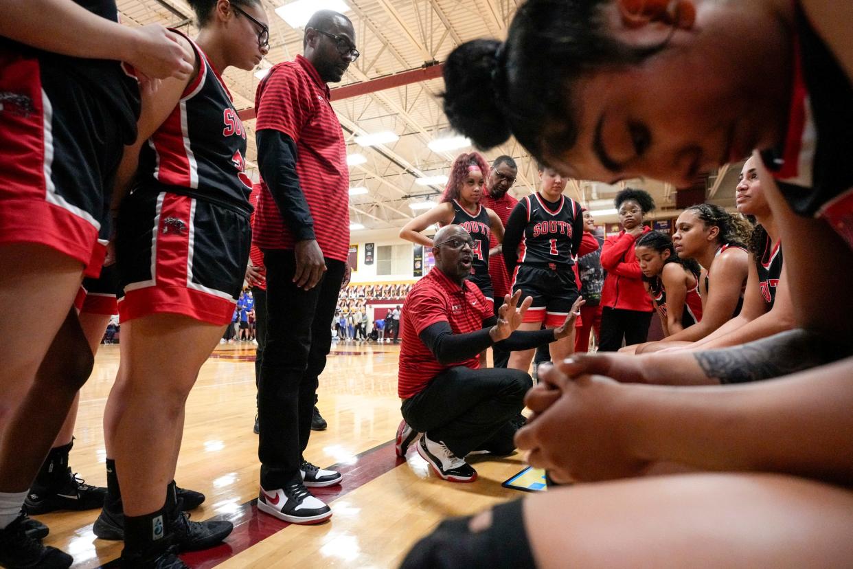 Westerville South coach Jermaine Guice speaks with his team during last season's regional semifinal loss to Marysville.
