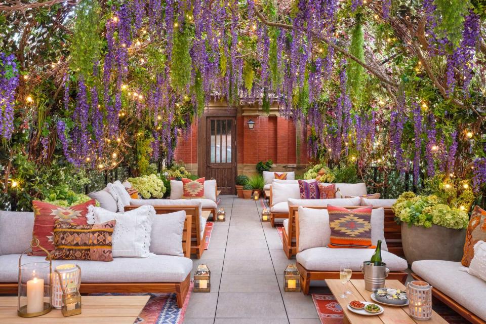 A wisteria shrouded terrace at The Beekman, voted one of the top hotels in New York City