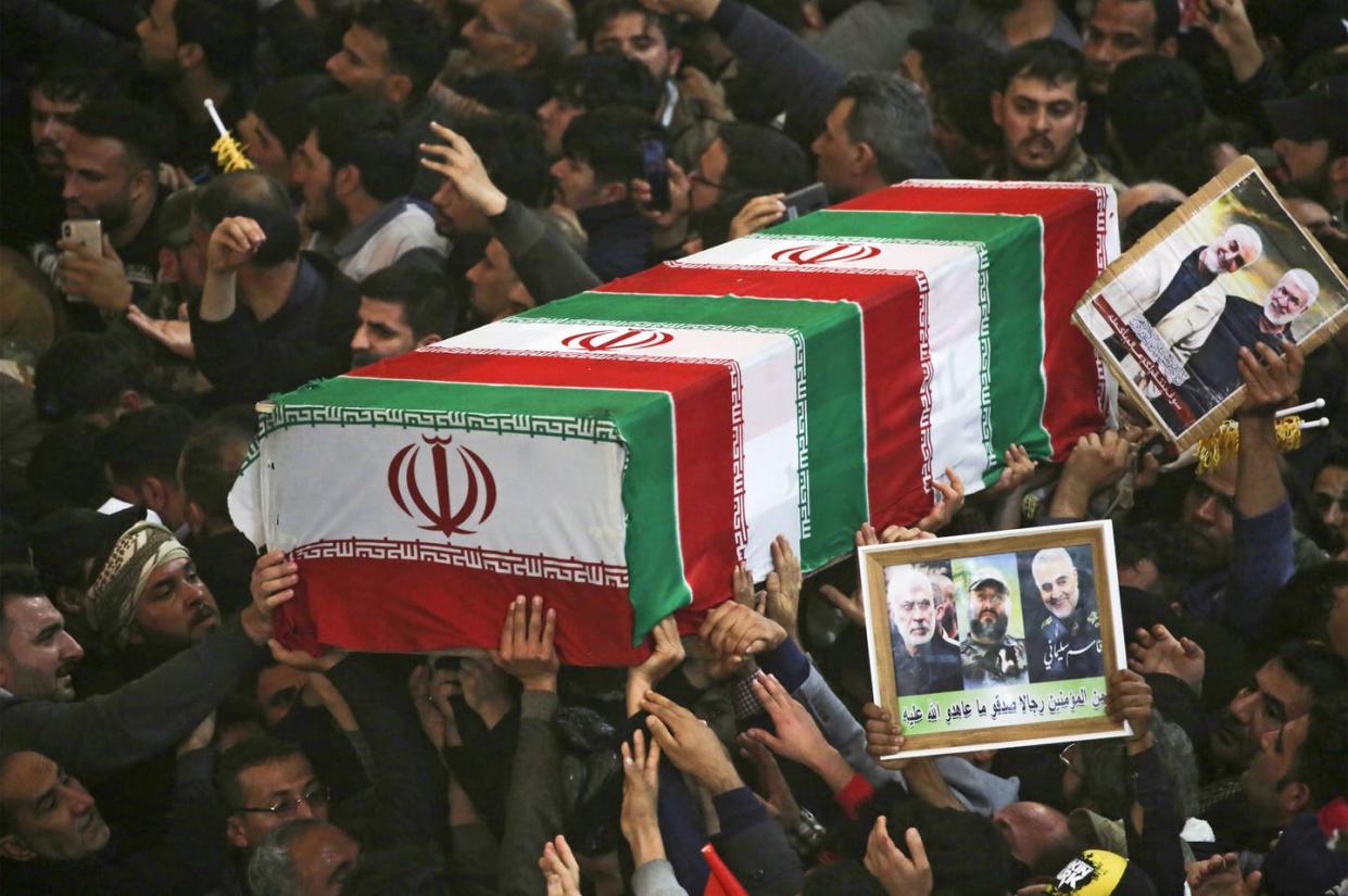 <span class="caption">Mourners carry the coffins of slain Iraqi paramilitary chief Abu Mahdi al-Muhandis, Iranian military commander Qasem Soleimani and eight others during a funeral procession in Karbala, Iraq on Jan. 4, 2020.</span> <span class="attribution"><a class="link " href="https://www.gettyimages.com/detail/news-photo/mourners-carry-the-coffins-of-slain-iraqi-paramilitary-news-photo/1191712299?adppopup=true" rel="nofollow noopener" target="_blank" data-ylk="slk:MOHAMMED SAWAF/AFP via Getty Images;elm:context_link;itc:0;sec:content-canvas">MOHAMMED SAWAF/AFP via Getty Images</a></span>