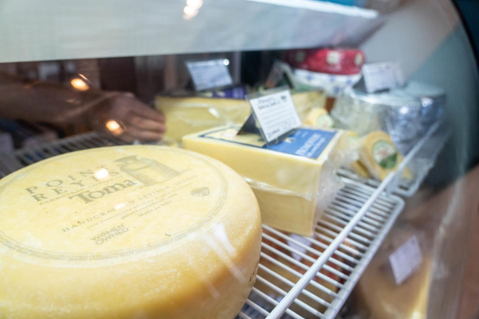 Point Reyes Farmstead Cheese Company's Toma cow's milk cheese is displayed along with other cheeses at Shea Cheese's new storefront in Phoenix on Nov. 10, 2022.