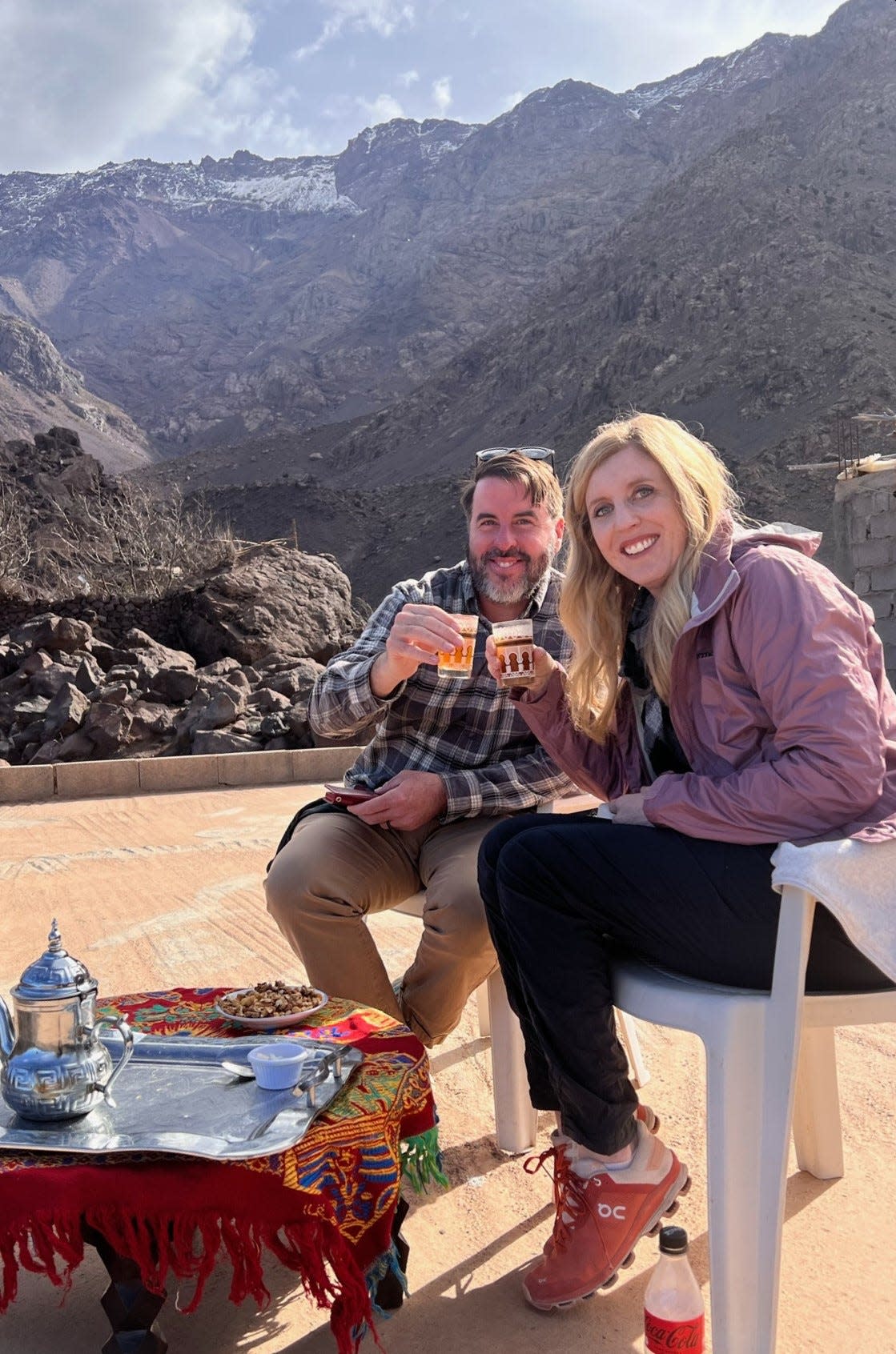 Jesse and Ashley Bermel of North Liberty enjoy a local delicacy, Moroccan mint tea and walnuts, in a traditional welcome at the home of their tour guide in the Atlas Mountains, where the September earthquake later occurred.