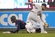 Minnesota Twins' Byron Buxton, left, steals second base on Detroit Tigers second baseman Isaac Paredes in the third inning of a baseball game, Tuesday, Sept. 28, 2021, in Minneapolis. (AP Photo/Jim Mone)