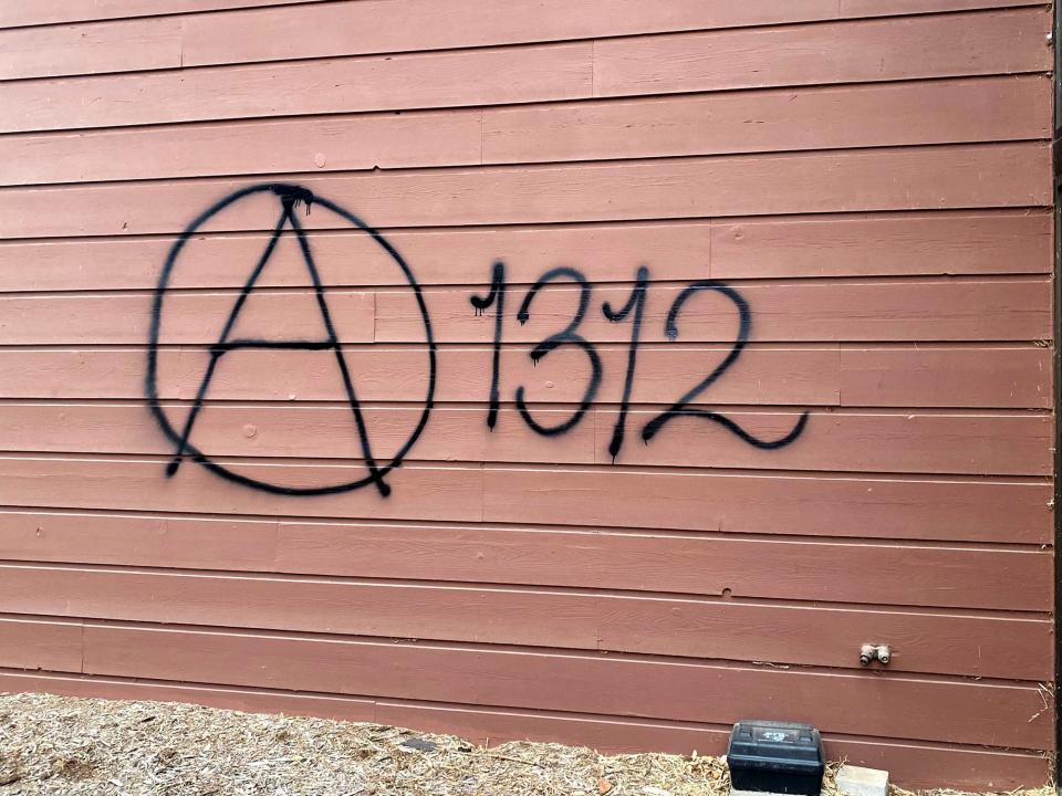 An apparent anarchist symbol was also spray-painted onto the side of the office for the Wisconsin Family Action.