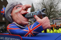 <p>A carnival float depicting British prime minister Theresa May with a pistol and the writing “Brexit” is surrounded by carnevalists at the traditional street carnival parade in Duesseldorf, Germany, Monday, Feb. 27, 2017. REUTERS/Wolfgang Rattay </p>