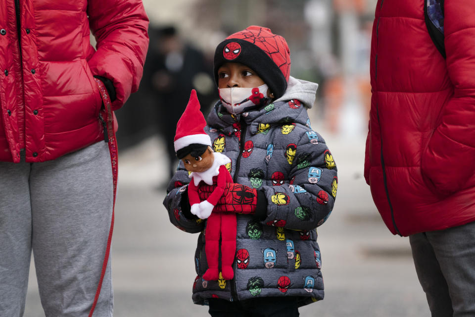 Jayceon Melendez arrives at P.S. 134 Henrietta Szold Elementary School, Monday, Dec. 7, 2020, in New York. Public schools reopened for in-school learning Monday after being closed since mid-November. (AP Photo/Mark Lennihan)