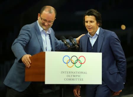 International Olympic Committee Evaluation Commission Chairman Patrick Baumann introduces IOC executive director Christophe Dubi as they hold a final press conference following three days of meetings and tours as part of LA 2024's bid for the Summer 2024 Olympic Games in Los Angeles, California, U.S., May 12, 2017. REUTERS/Mike Blake