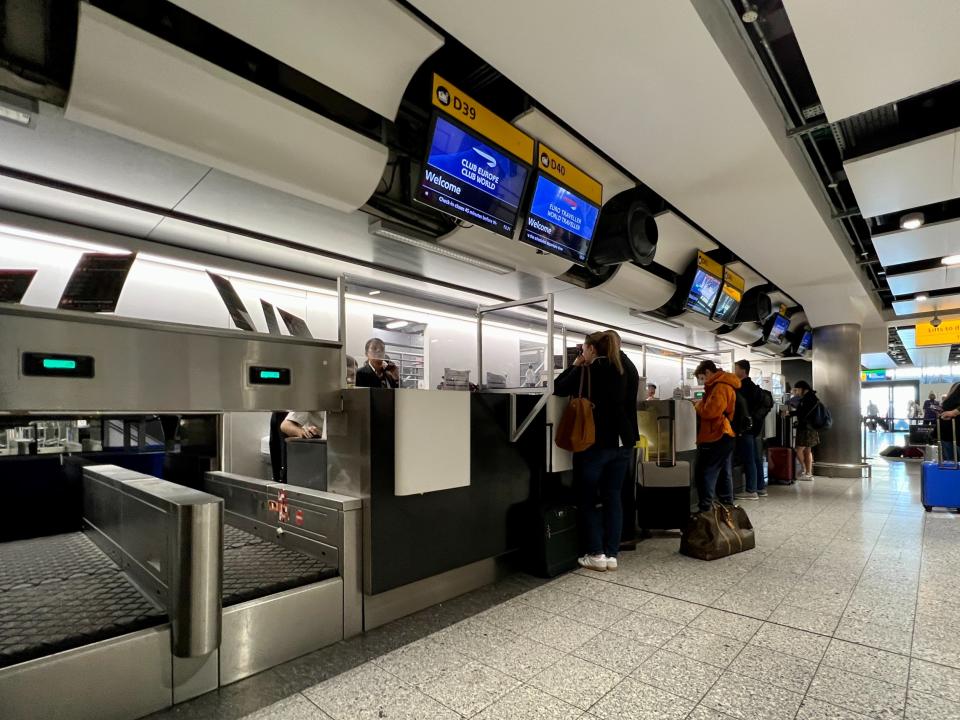 Holidaymakers wait at British Airways check in at Terminal 3, from which some of the cancelled flights were due to depart (Simon Calder/The Independent)