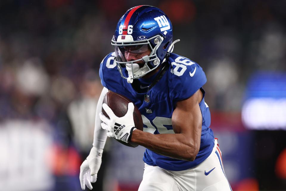 EAST RUTHERFORD, NEW JERSEY - JANUARY 07: Darius Slayton #86 of the New York Giants runs the ball for a touchdown during the second quarter in the game against the Philadelphia Eagles at MetLife Stadium on January 07, 2024 in East Rutherford, New Jersey. (Photo by Elsa/Getty Images)