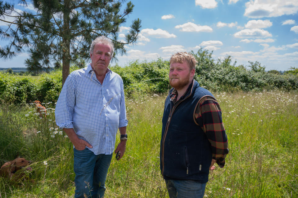 Clarkson's Farm stars Jeremy Clarkson and Kaleb in a field  (Prime Video)