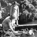 <p>Elizabeth plays with her sister in Buckinghamshire (PA Archive) </p>