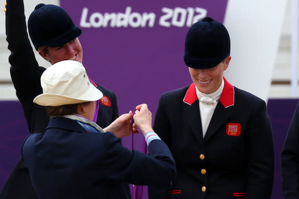 Zara Phillips is presented a silver medal by her mother, Princess Anne, the Princess Royal, after the Eventing Team Jumping Final Equestrian event on Day 4 of the London 2012 Olympic Games at Greenwich Park in London, England on July 31, 2012. | Alex Livesey—Getty Images